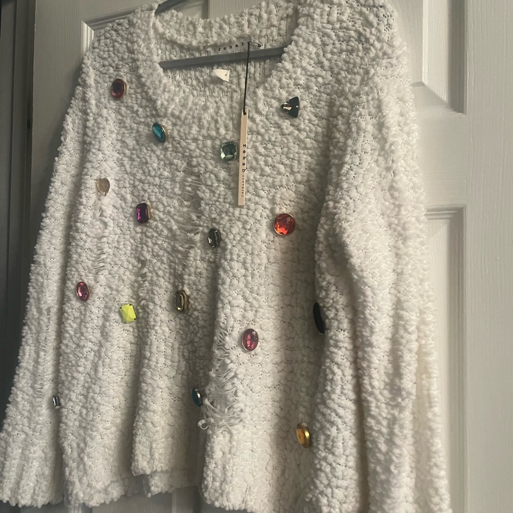 Cute sweater with colorful jewels and rips. Pair with a cute tank under. M/L